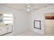 Bedroom with a ceiling fan and access to the bathroom and living room at 7 High St, Bradenton, FL 34208