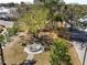 Community park features mature trees, lush landscaping, picnic benches, and a fountain at 7 High St, Bradenton, FL 34208