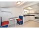 A quaint kitchen with a cozy breakfast nook and modern white appliances at 7 High St, Bradenton, FL 34208