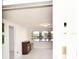 Bright, airy living room with white walls, floors, and a charming electric fireplace at 7 High St, Bradenton, FL 34208
