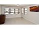 Living room with new windows, art, light floors and walls creates a serene ambiance at 7 High St, Bradenton, FL 34208