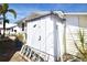 View of a shed next to a single story home with a ladder in front at 7 High St, Bradenton, FL 34208