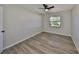 Bedroom with light walls, a window, and updated flooring at 7104 13Th E St, Sarasota, FL 34243