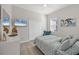 Well-lit bedroom with a queen bed, a dresser, and a serene atmosphere at 7163 Tamworth Pkwy, Sarasota, FL 34241