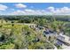 Aerial view of a gated community entrance, featuring lush greenery and manicured landscaping at 7163 Tamworth Pkwy, Sarasota, FL 34241