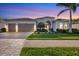 Stunning home boasting manicured lawn, arched entryway, and a convenient three-car garage at 7163 Tamworth Pkwy, Sarasota, FL 34241