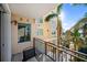 Outdoor patio with table and chairs overlooking water at 750 N Tamiami Trl # 407, Sarasota, FL 34236