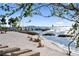 Relaxing beachfront with chairs, offering stunning views of the bay and the harbor at 750 N Tamiami Trl # 407, Sarasota, FL 34236