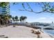 Picturesque beachfront scene, chairs for relaxation with views of the bay and bridge at 750 N Tamiami Trl # 407, Sarasota, FL 34236