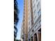Low angle view of modern building with balconies, and architectural detail at 750 N Tamiami Trl # 407, Sarasota, FL 34236
