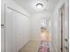 A bright tiled foyer featuring closet space and an open view into the living spaces at 750 N Tamiami Trl # 407, Sarasota, FL 34236
