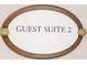 Elegant signage for guest suite 2 providing clear directional guidance at 750 N Tamiami Trl # 407, Sarasota, FL 34236