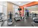 Well-equipped gym area with treadmills, elliptical machines, and a television at 750 N Tamiami Trl # 407, Sarasota, FL 34236