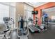 Well-equipped gym area with treadmills, elliptical machines, and a television at 750 N Tamiami Trl # 407, Sarasota, FL 34236