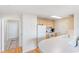 Functional kitchen featuring wooden cabinets, white appliances, and a practical countertop at 750 N Tamiami Trl # 407, Sarasota, FL 34236