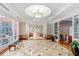 Beautiful lobby area with decorative flooring, large windows, and access to amenities at 750 N Tamiami Trl # 407, Sarasota, FL 34236
