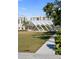 Landscaped park area featuring a unique white architectural shade feature and lush greenery at 750 N Tamiami Trl # 407, Sarasota, FL 34236