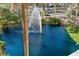 Beautiful water feature with fountain, surrounded by lush landscaping and a view of the city at 750 N Tamiami Trl # 407, Sarasota, FL 34236
