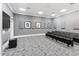 Well-equipped theater room featuring comfortable seating, a large screen, and acoustic panels at 750 N Tamiami Trl # 407, Sarasota, FL 34236