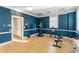 Workout room with a punching bag, weights, and benches for a comprehensive fitness regimen at 750 N Tamiami Trl # 407, Sarasota, FL 34236