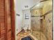 Bathroom features include a glass-enclosed shower and tile flooring at 7717 27Th W Ave, Bradenton, FL 34209