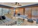 Comfortable bedroom area with two twin beds, wood-look floors, and wooden window blinds at 7717 27Th W Ave, Bradenton, FL 34209