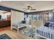 Comfortable bedroom area with two twin beds, wood-look floors, and decorative pillows at 7717 27Th W Ave, Bradenton, FL 34209