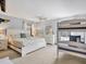 Bright bedroom with a large bed, bunk beds, and a ceiling fan at 7717 27Th W Ave, Bradenton, FL 34209