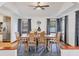 Cozy dining room featuring a wooden table, seating for six, and plenty of natural light at 7717 27Th W Ave, Bradenton, FL 34209