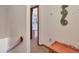 A hallway leads to a bedroom with neutral carpet and beach themed decor at 7717 27Th W Ave, Bradenton, FL 34209