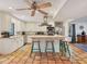 Bright kitchen with stainless steel appliances, center island, and tile flooring at 7717 27Th W Ave, Bradenton, FL 34209