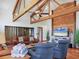 Bright and airy living room with vaulted ceilings, exposed beams, wood floors and comfortable seating at 7717 27Th W Ave, Bradenton, FL 34209