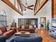 Spacious living room with exposed beams, wood floors and two leather couches, perfect for entertaining at 7717 27Th W Ave, Bradenton, FL 34209