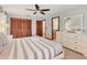 The main bedroom features an ensuite bathroom, a ceiling fan, and a large closet at 7717 27Th W Ave, Bradenton, FL 34209