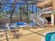Inviting screened-in pool area with comfortable seating and serene views, perfect for relaxation and outdoor enjoyment at 7717 27Th W Ave, Bradenton, FL 34209