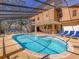 Wonderful screened pool and outdoor bar area with comfortable seating, ideal for entertaining guests or enjoying Gathering time at 7717 27Th W Ave, Bradenton, FL 34209