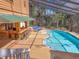 Wonderful screened pool and outdoor bar area with comfortable seating, ideal for entertaining guests or enjoying Gathering time at 7717 27Th W Ave, Bradenton, FL 34209