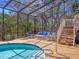Inviting screened-in pool area with comfortable seating and serene views, perfect for relaxation and outdoor enjoyment at 7717 27Th W Ave, Bradenton, FL 34209