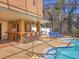 The screened pool and bar area, featuring a charming tropical design, perfect for relaxing and enjoying the outdoors at 7717 27Th W Ave, Bradenton, FL 34209