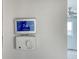 Digital and manual thermostats on a wall in partially renovated room at 775 John Ringling Blvd # 3, Sarasota, FL 34236
