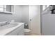 Bathroom with white fixtures, gray walls, and a clean, minimalist design at 8003 Herbison Ave, North Port, FL 34287