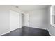 Cozy bedroom with hardwood floors, closet, and ample natural light at 8003 Herbison Ave, North Port, FL 34287