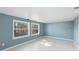 Bedroom with tile flooring and large windows offering views of the outdoor space at 8003 Herbison Ave, North Port, FL 34287