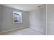 Bedroom featuring tiled floors, a window, and a closet at 8003 Herbison Ave, North Port, FL 34287