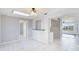 Dining room with tiled floors, skylight, and open layout at 8003 Herbison Ave, North Port, FL 34287