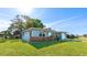 Charming single-story home featuring a well-maintained lawn and attached garage at 8003 Herbison Ave, North Port, FL 34287