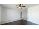 Spacious living room with tile and hardwood floors, offering versatile living space at 8003 Herbison Ave, North Port, FL 34287