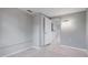 Living space with tiled floors, closet, and access to a well-lit hallway at 8003 Herbison Ave, North Port, FL 34287