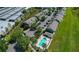 Aerial view showcasing community with pool, parking, and green spaces at 8850 Christie Dr, Largo, FL 33771