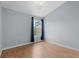 Bedroom with a window and curtain with light blue walls at 8850 Christie Dr, Largo, FL 33771